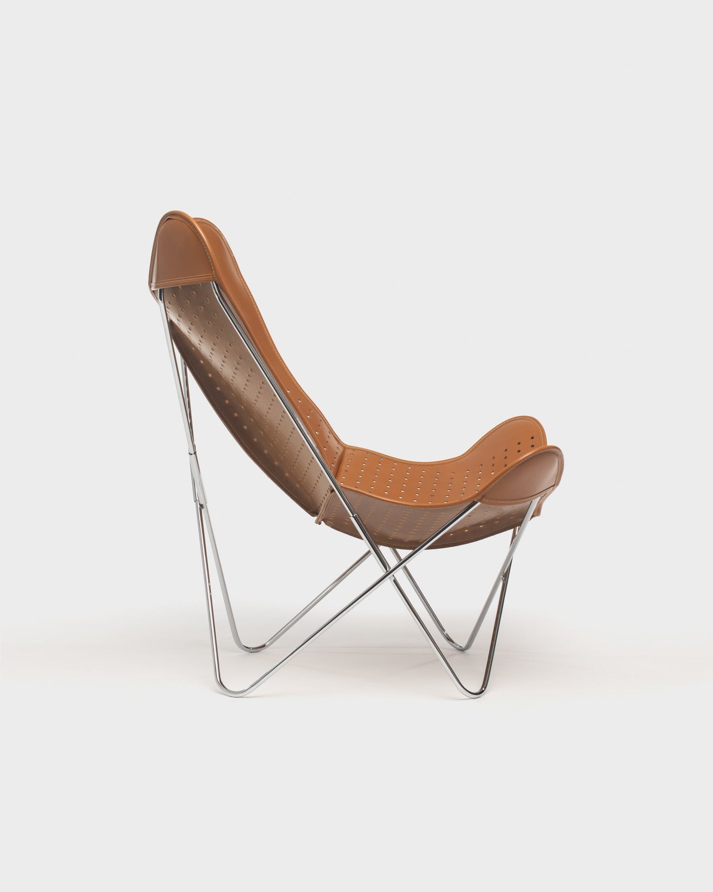 Fauteuil Papillon Cuir ajouré cognac - Structure inox - Vue de profil