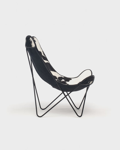 Fauteuil papillon cuir Vache Noire Blanc Structure Noire - Vue de profil